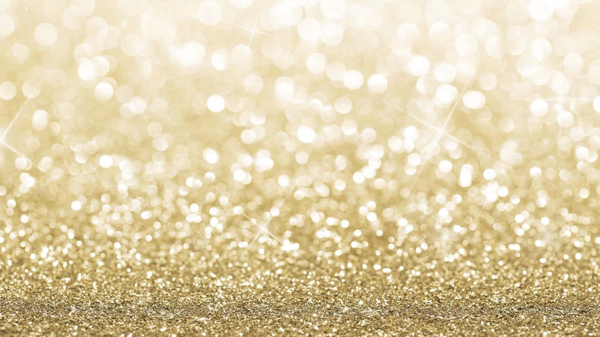 A Gold Glitter Background With Sparkles Wallpaper