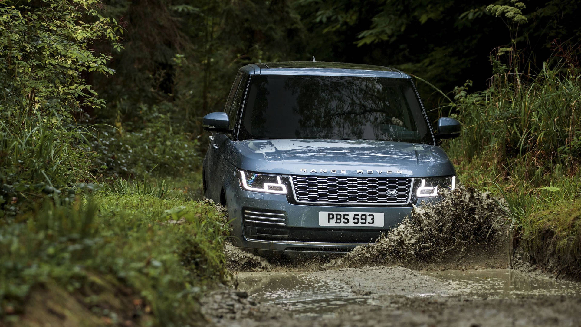 Luxurious adventure awaits in this metallic gray Land Rover Wallpaper