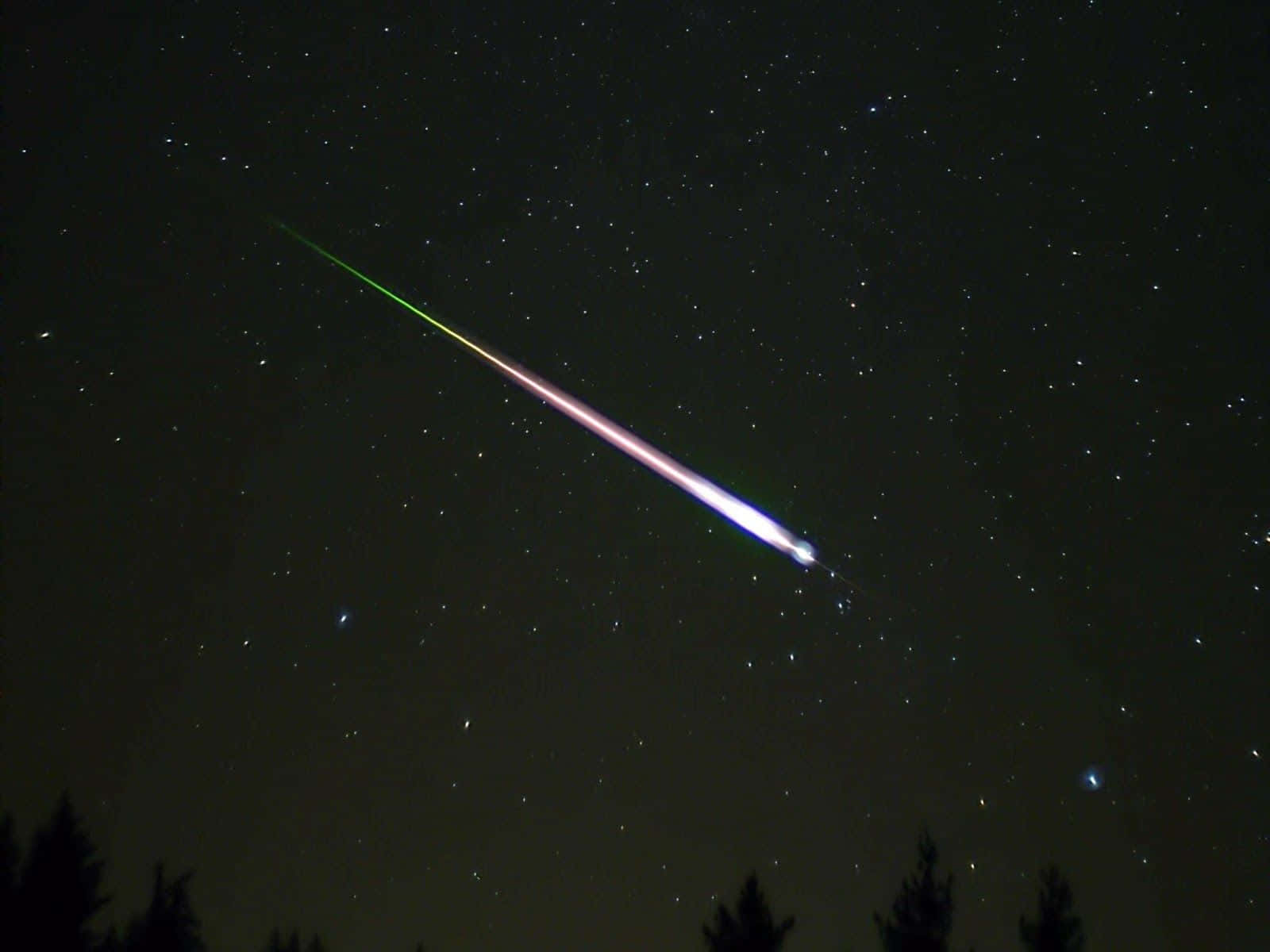 Spectacular Meteor Shower in Night Sky Wallpaper