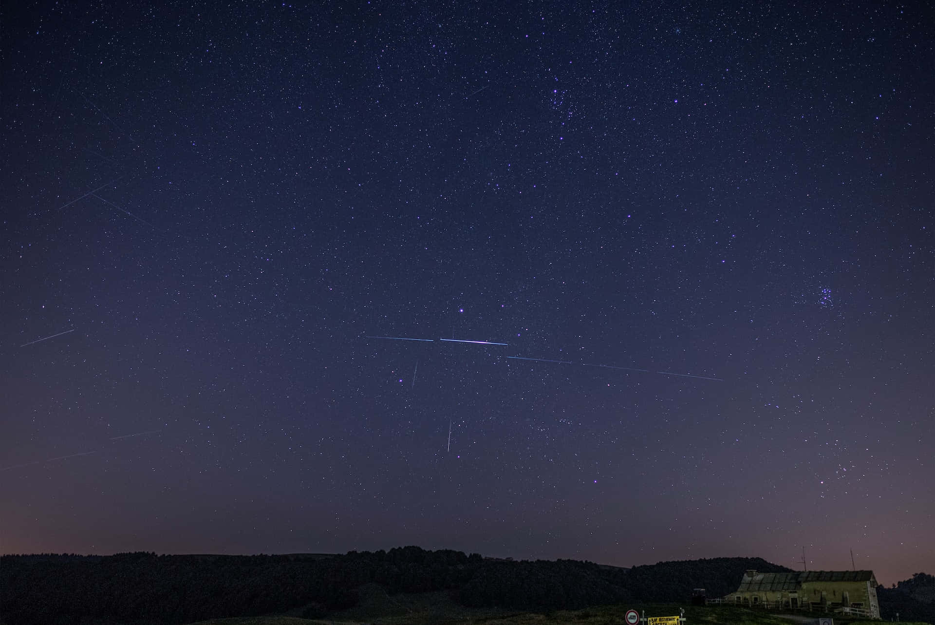 Spectacular Meteor Shower Across the Night Sky Wallpaper