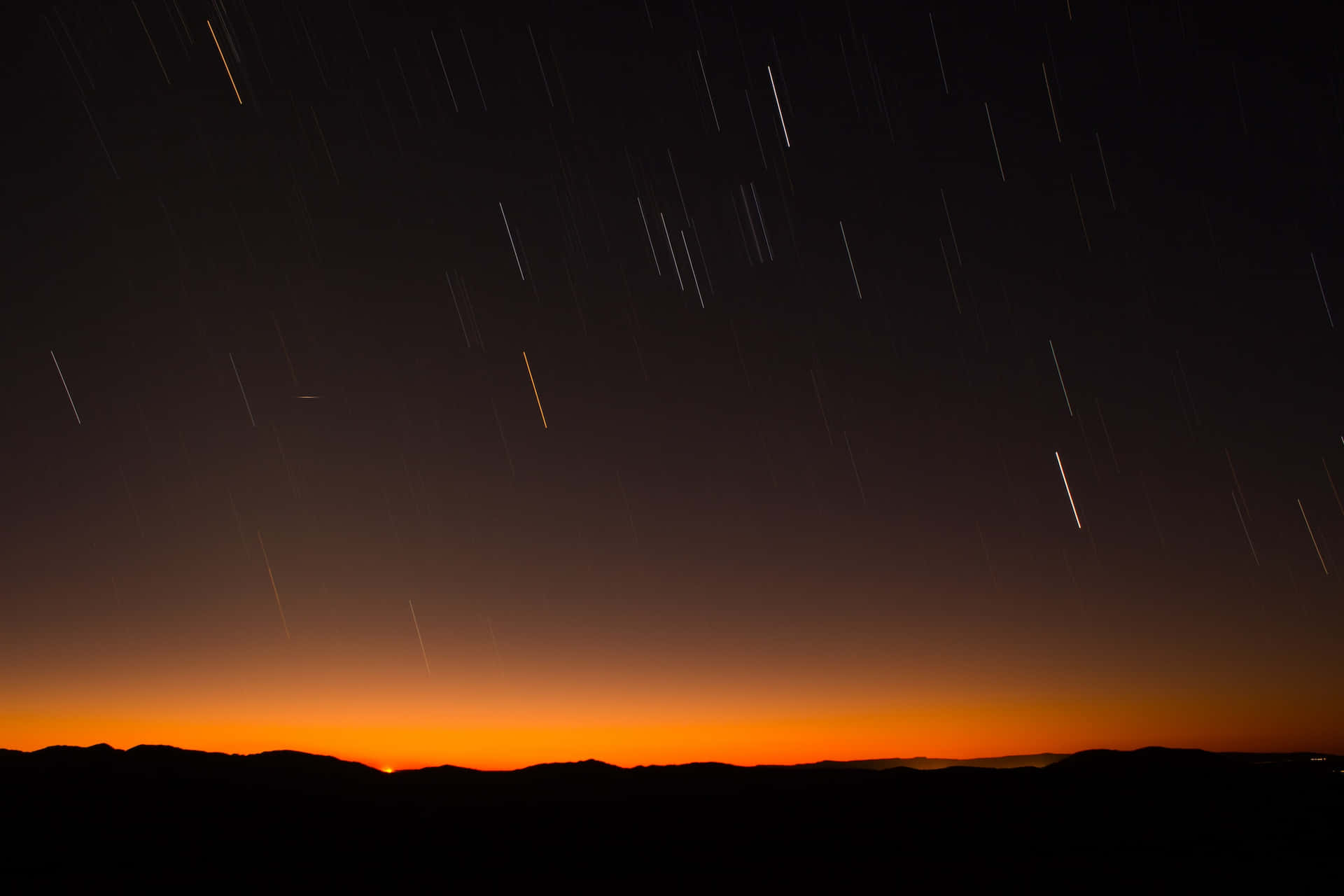 Meteor Shower in the Night Sky Wallpaper