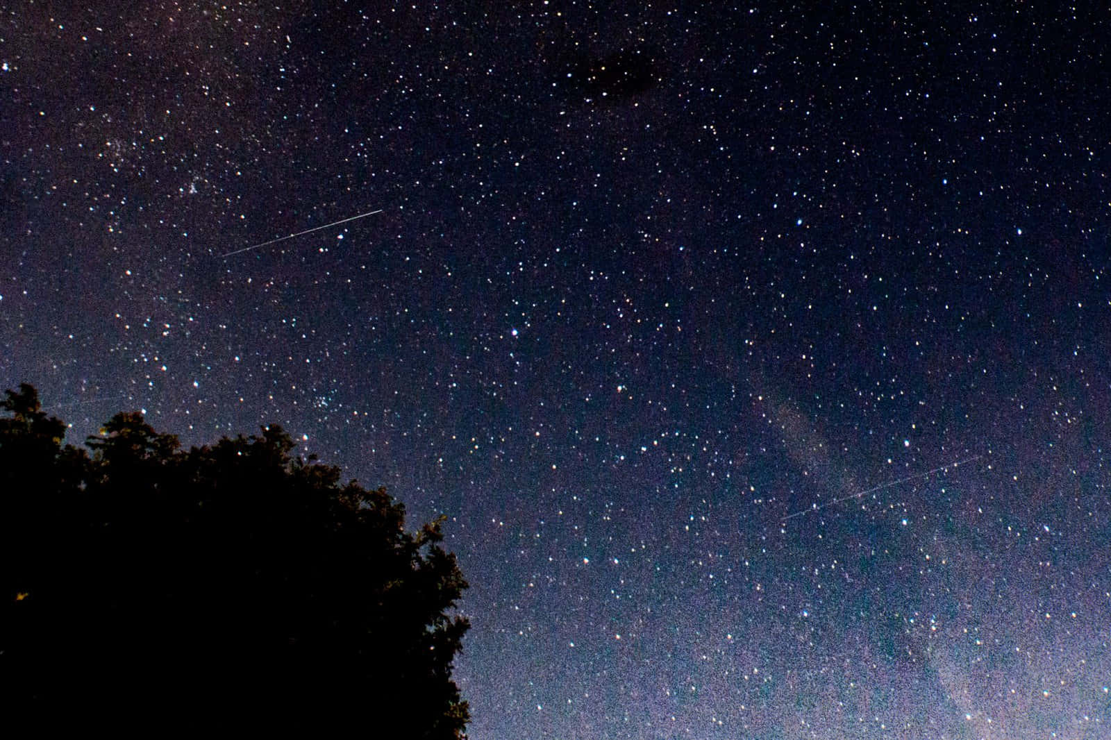 Illuminated Meteor Falling Through the Night Sky