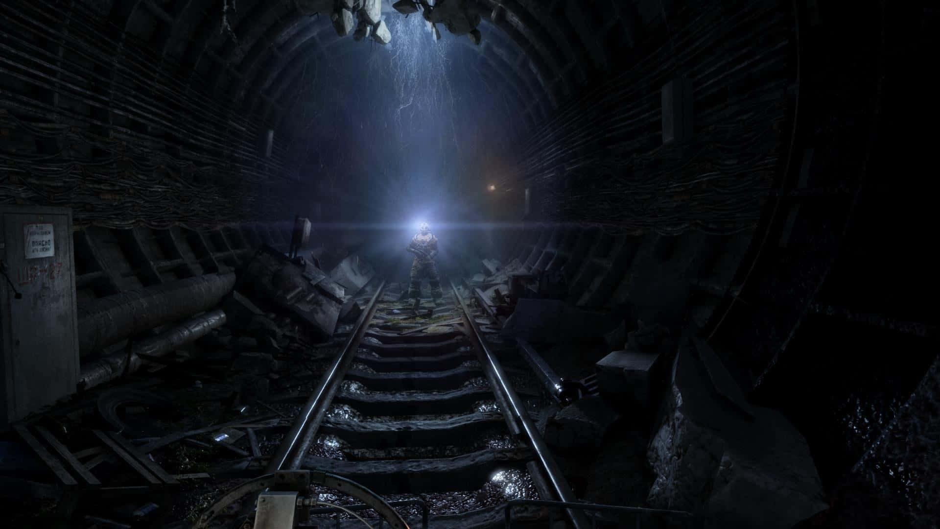A Train Is Going Through A Tunnel With A Light Shining On It