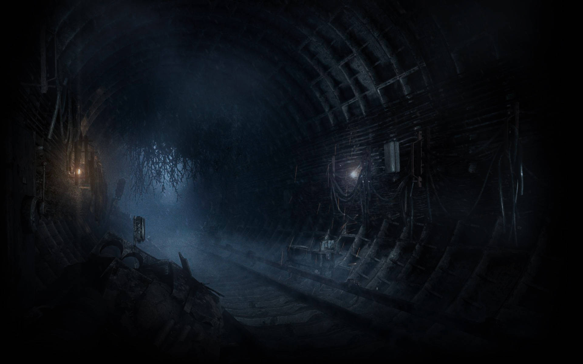 en mørk tunnel med lys i den Wallpaper
