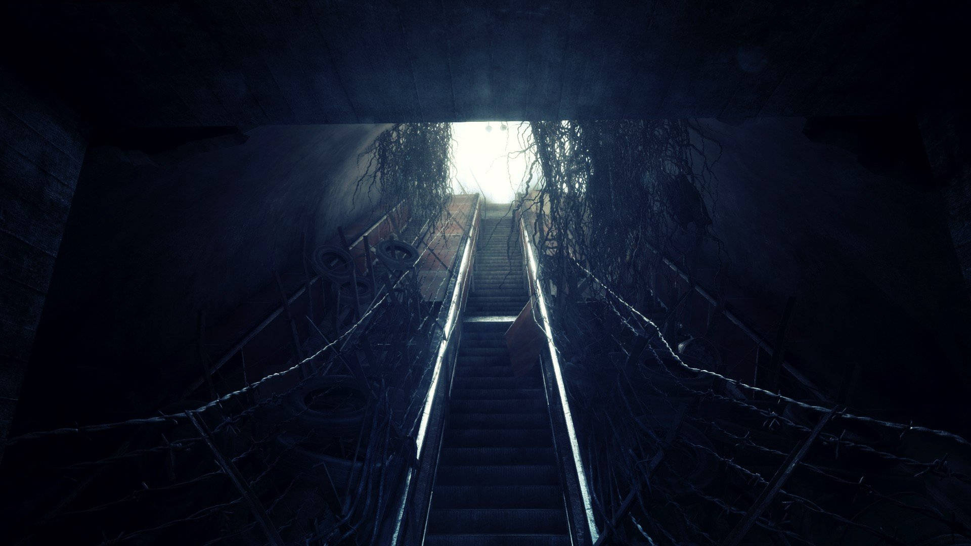 A Dark Stairway With A Light Shining Through Wallpaper
