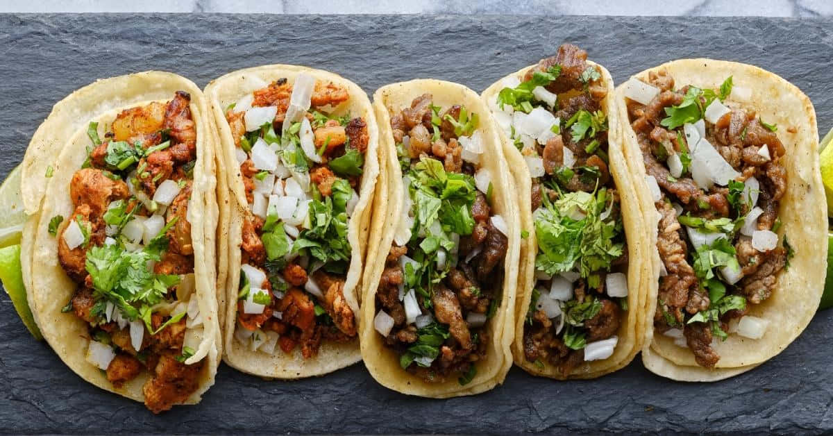 Five Tacos On A Slate Board
