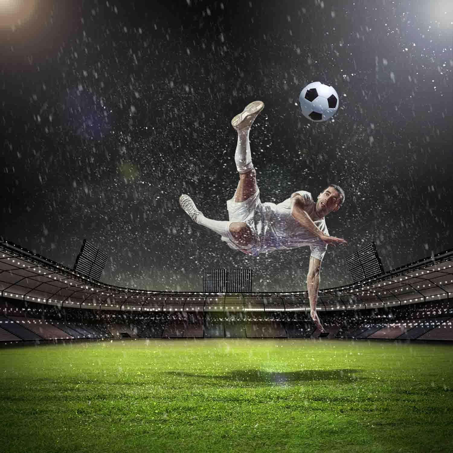 Soccer Player Kicking A Soccer Ball In The Rain Wallpaper