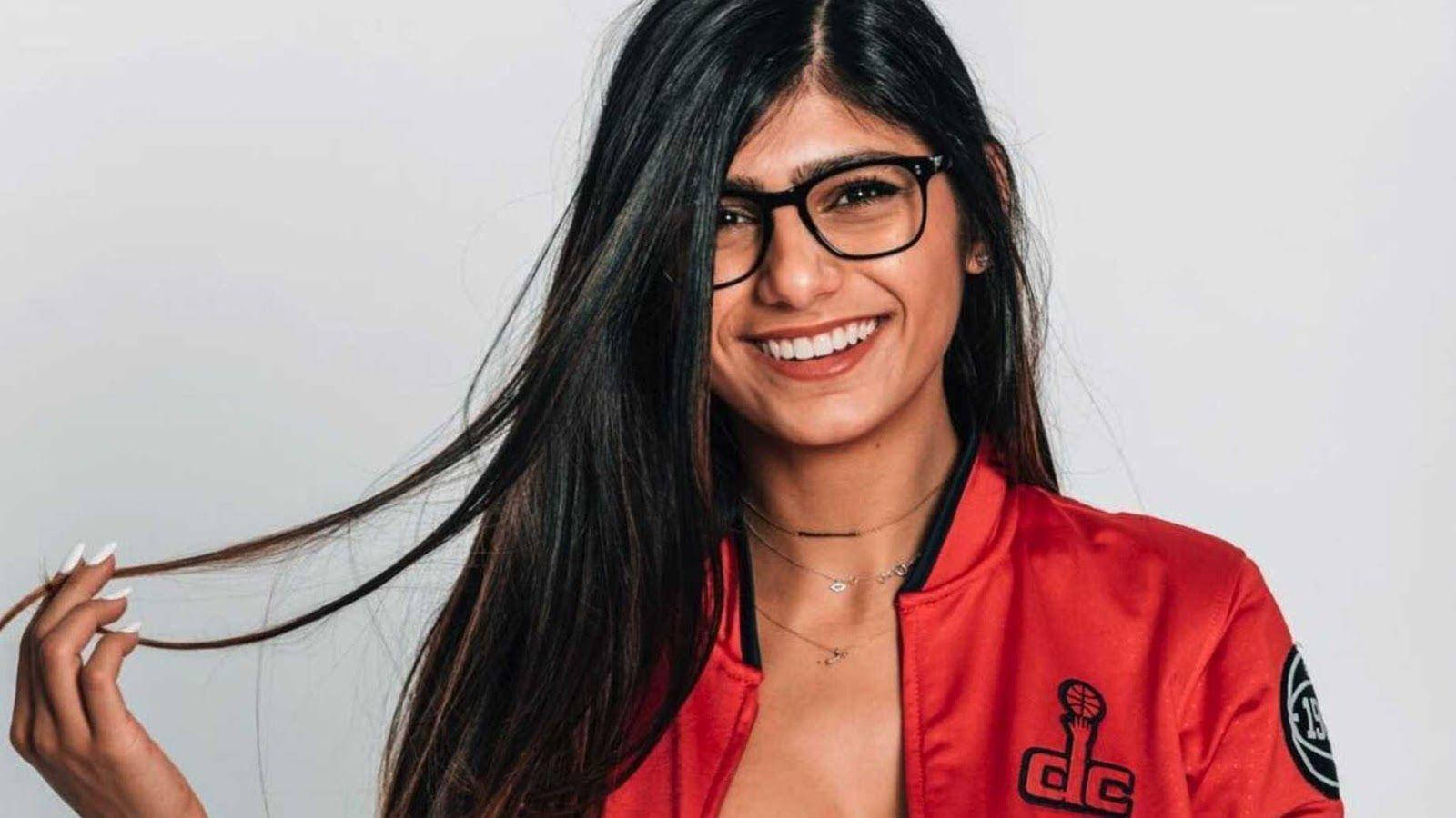 1600px x 900px - Download Stunning Mia Khalifa in Red Jacket Wallpaper | Wallpapers.com