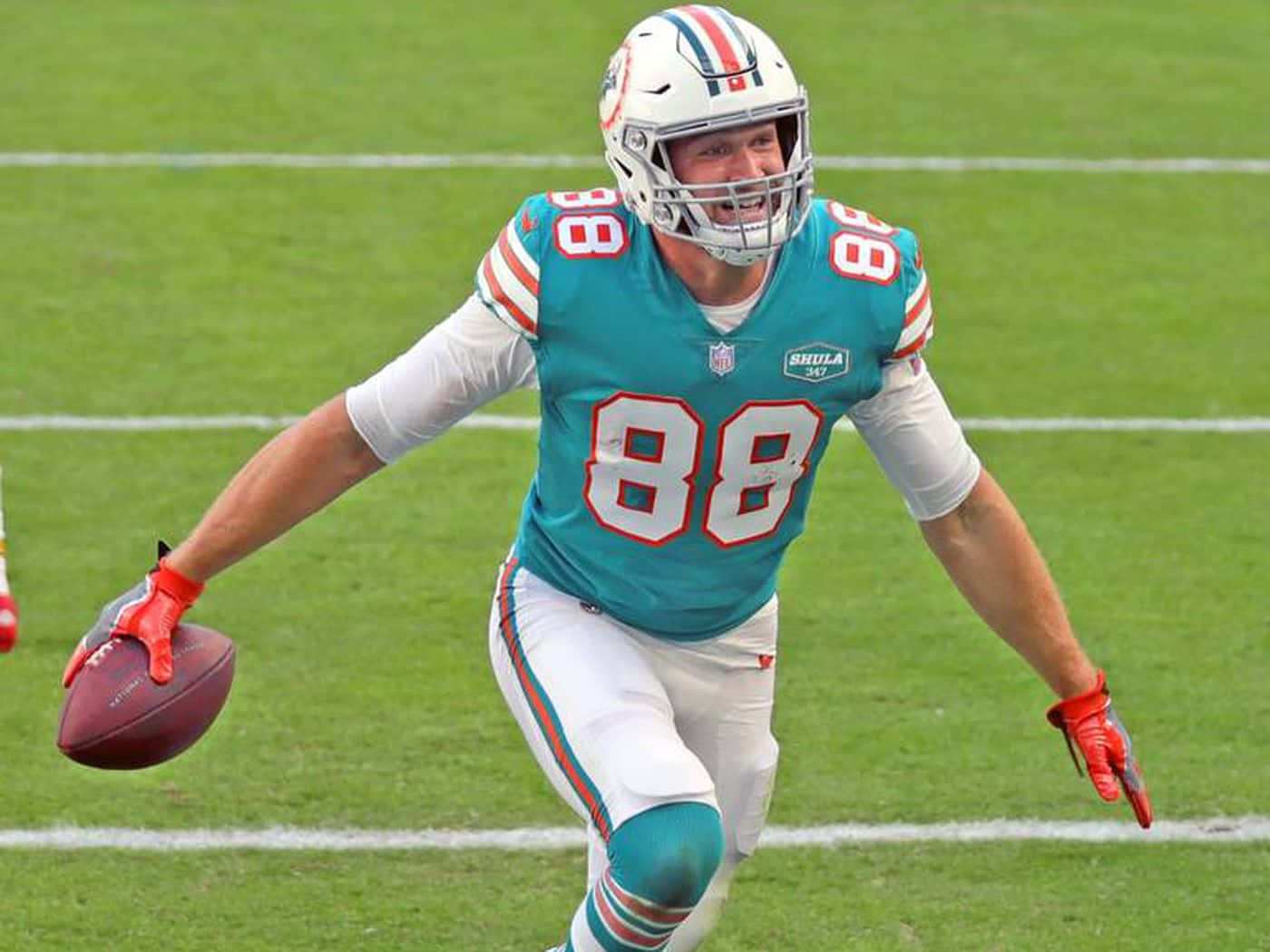 Miami Dolphins Player In Action Wallpaper