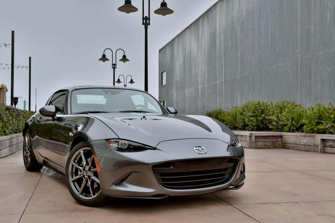 The 2018 Mazda Mx-5 Parked On The Side Of The Street Wallpaper