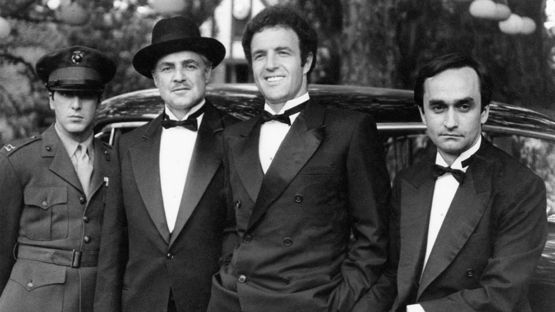 Michael Corleone With His Father And Brothers Wallpaper
