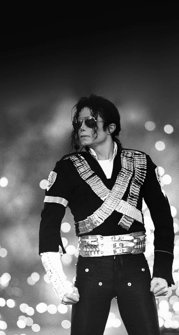 Enjoy your favorite songs by Michael Jackson on your iPhone Wallpaper