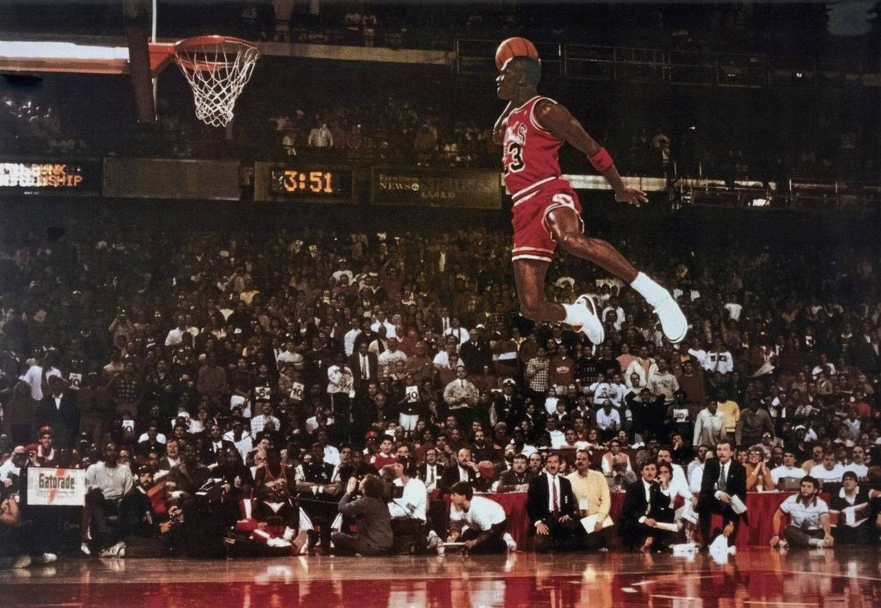 Michael Jordan reaches epic ids with a flying slam dunk Wallpaper