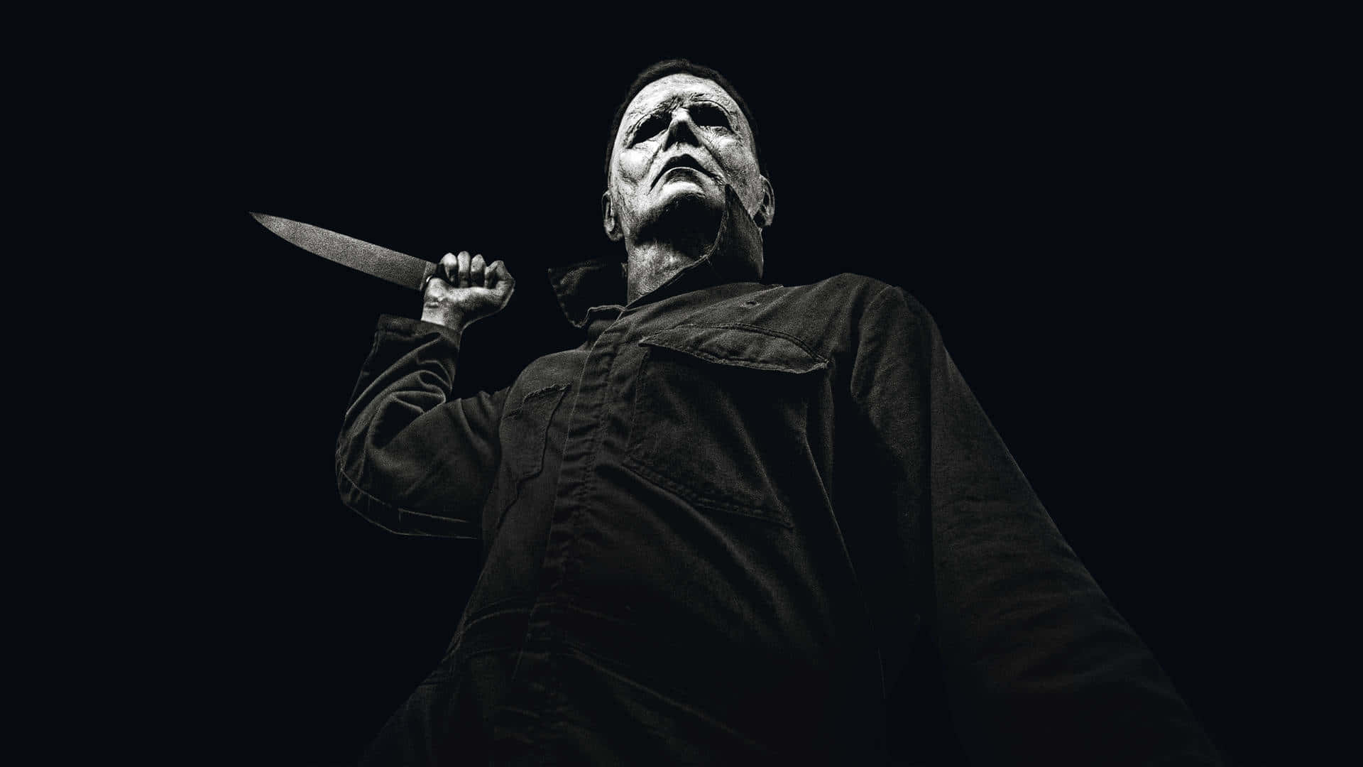 Download Menacing Michael Myers emerges from the darkness | Wallpapers.com