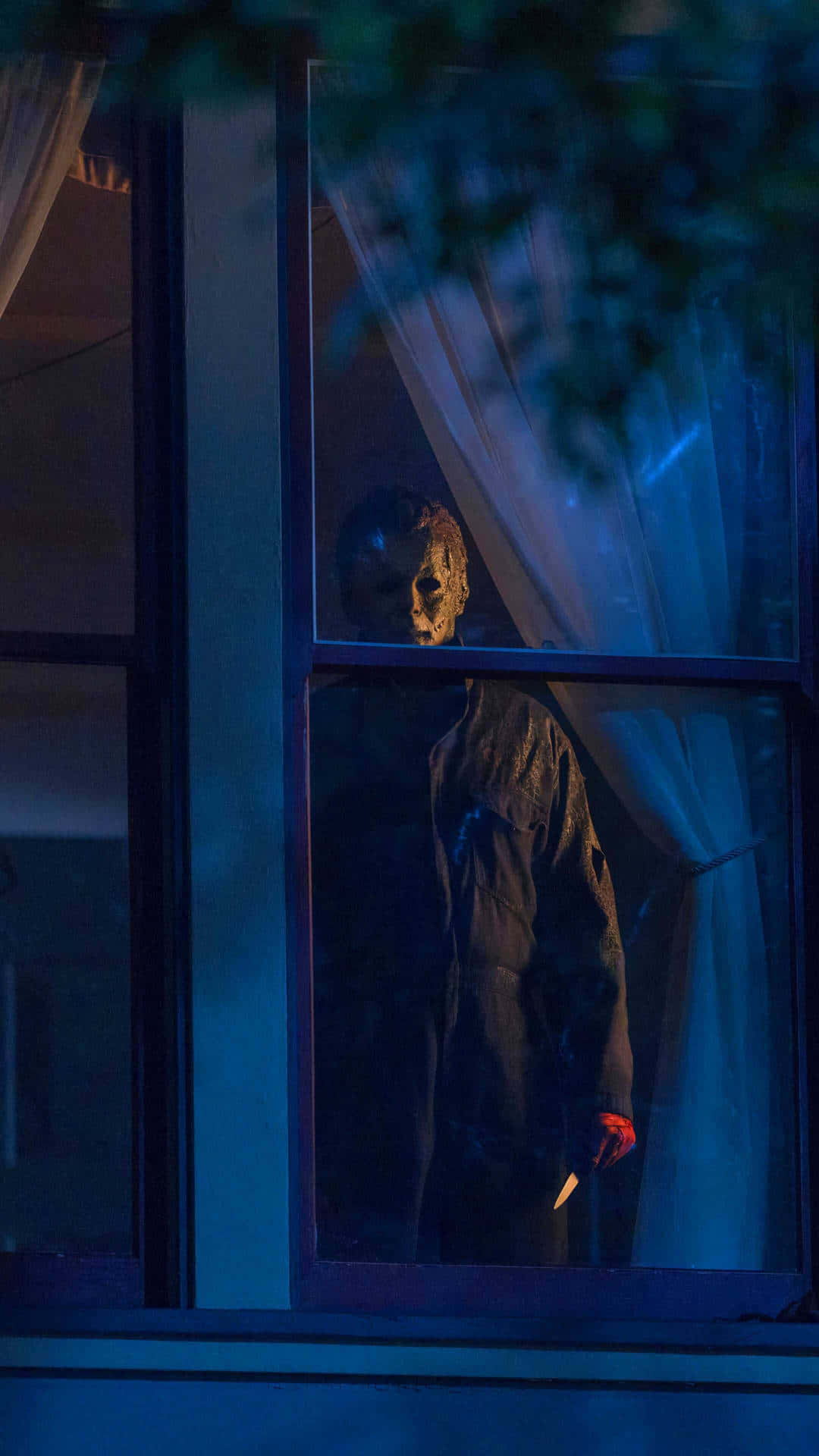 Michael Myers Lurking Behind Window Wallpaper