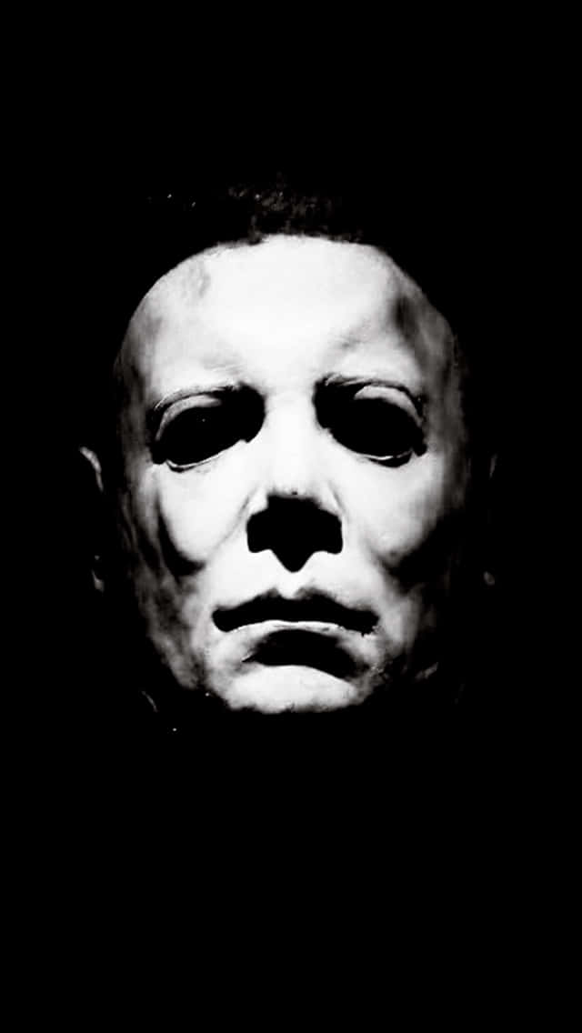 Et sort og hvidt billede af et halloween-maske Wallpaper