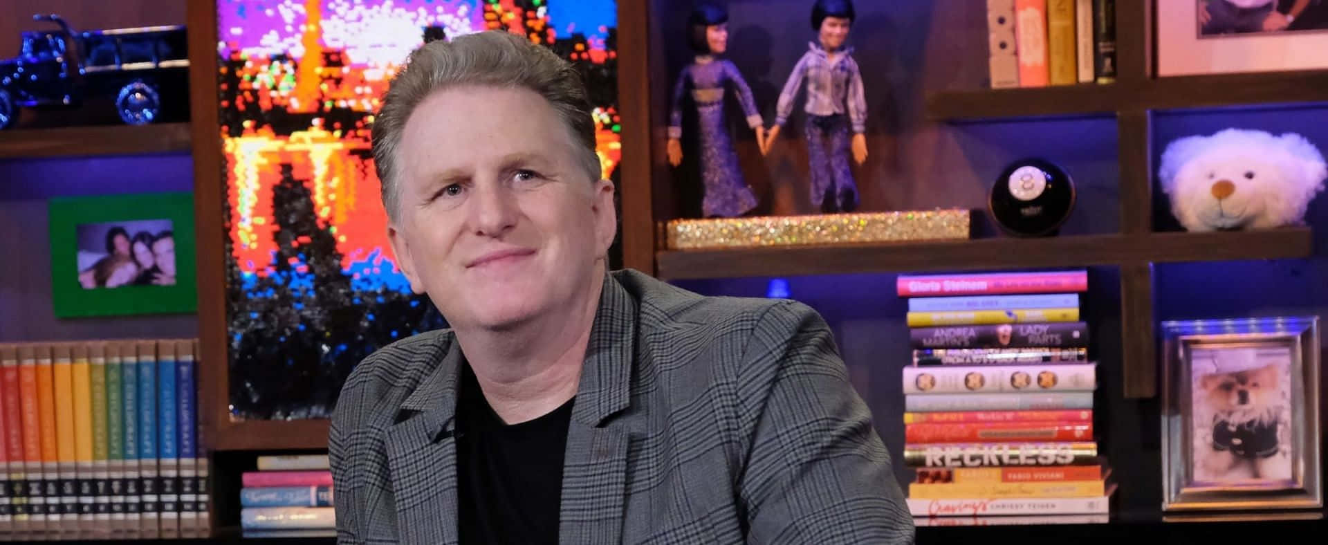 Michael Rapaport striking a confident pose on a dramatic dark background Wallpaper