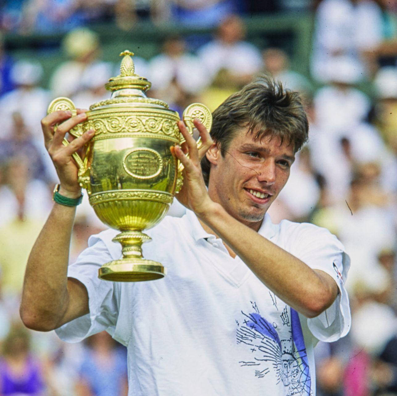 Caption: Michael Stich Triumphantly Holding a Tennis Trophy Wallpaper