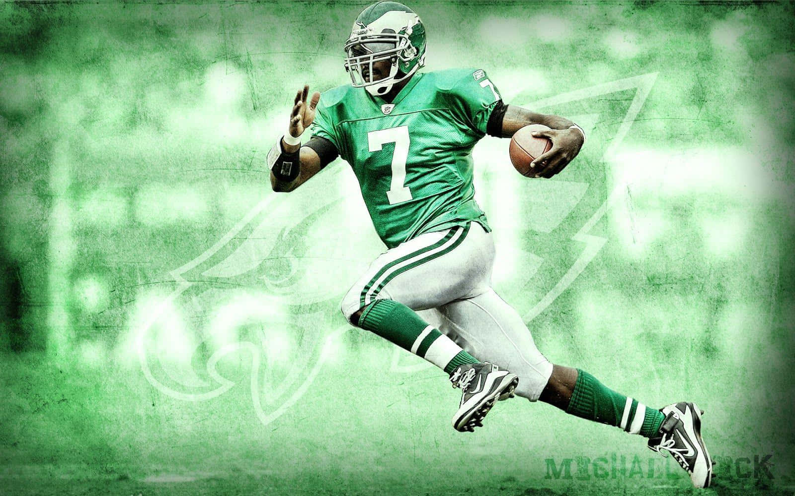 NFL great Michael Vick on the field in his prime Wallpaper