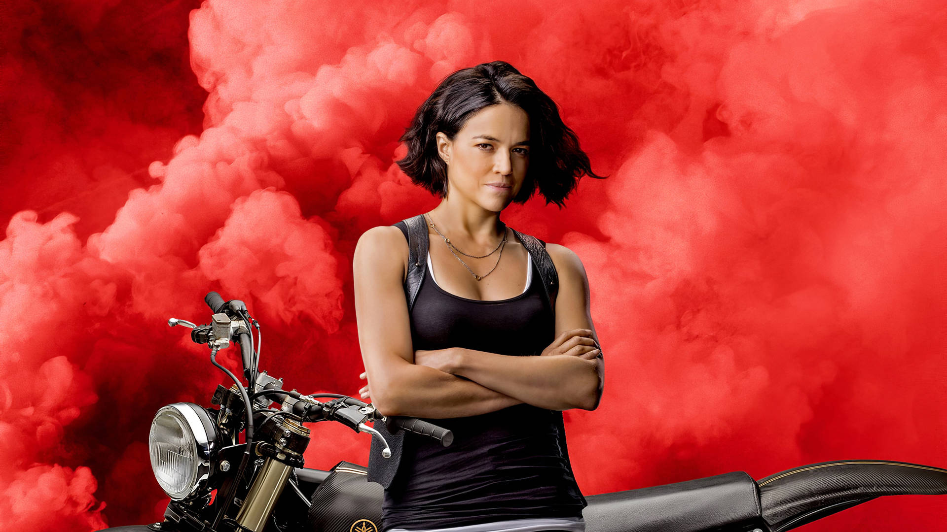 Michelle Rodriguez in a pinnacle scene from Fast and Furious 9 Wallpaper