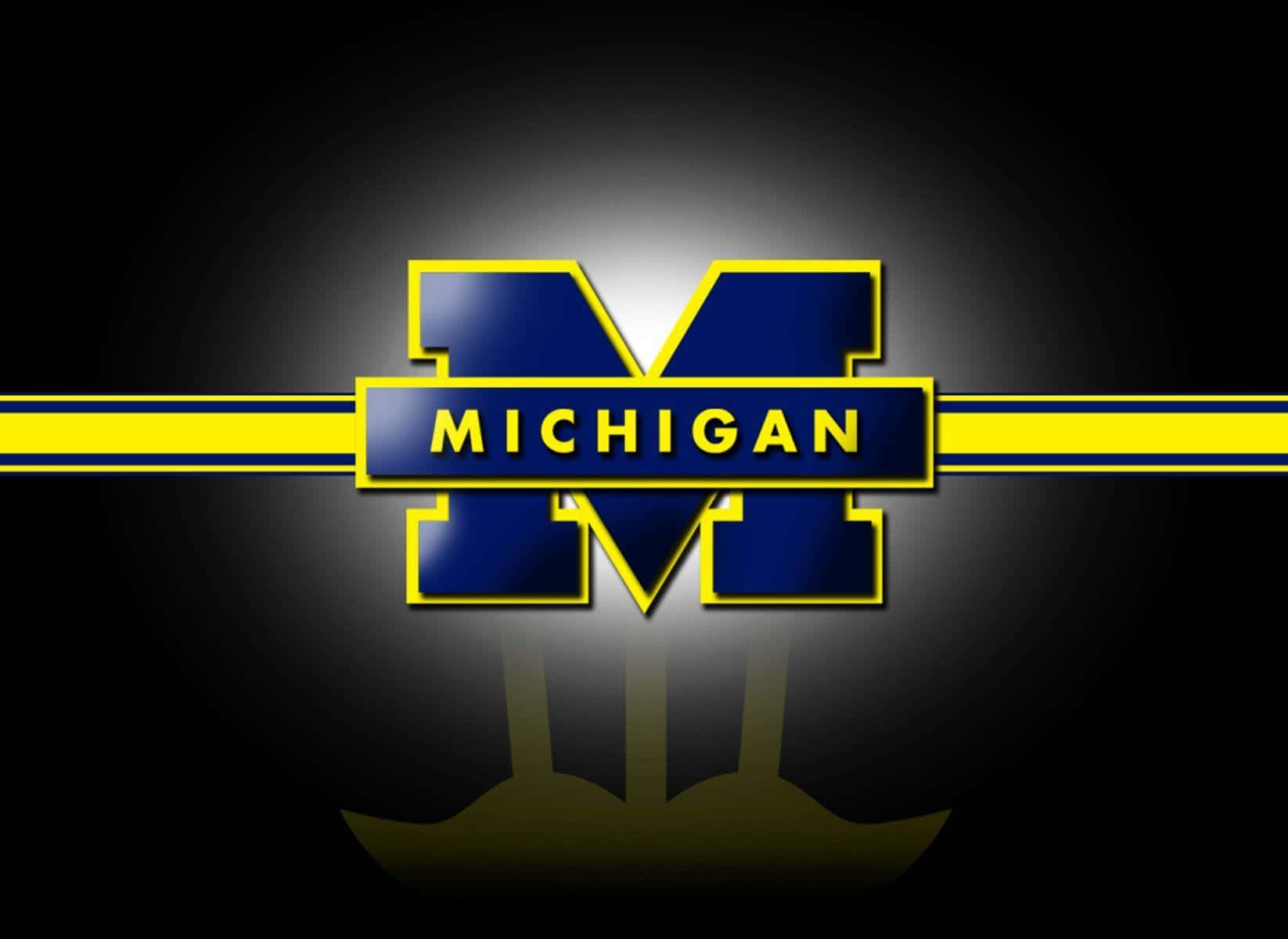 Aequipe De Futebol Da Universidade De Michigan Está Pronta Para Ação. Papel de Parede