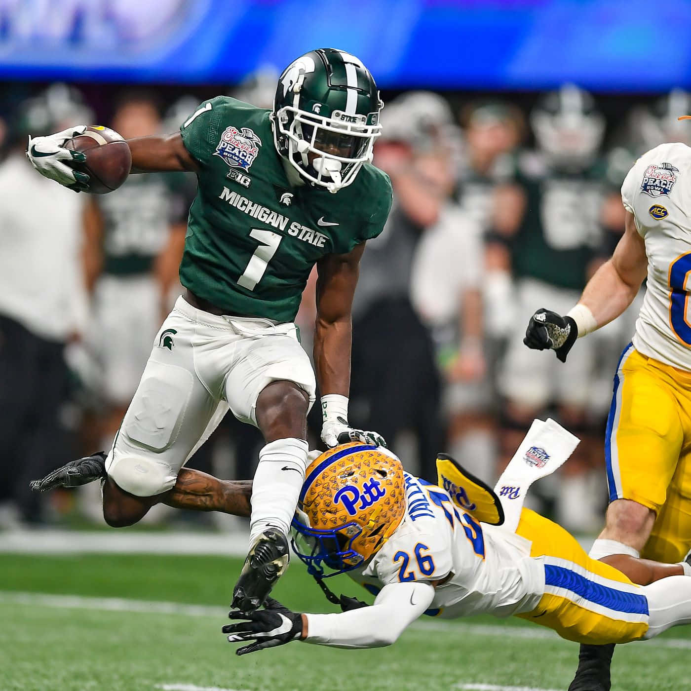 Michigan State Player Evades Tackle Wallpaper