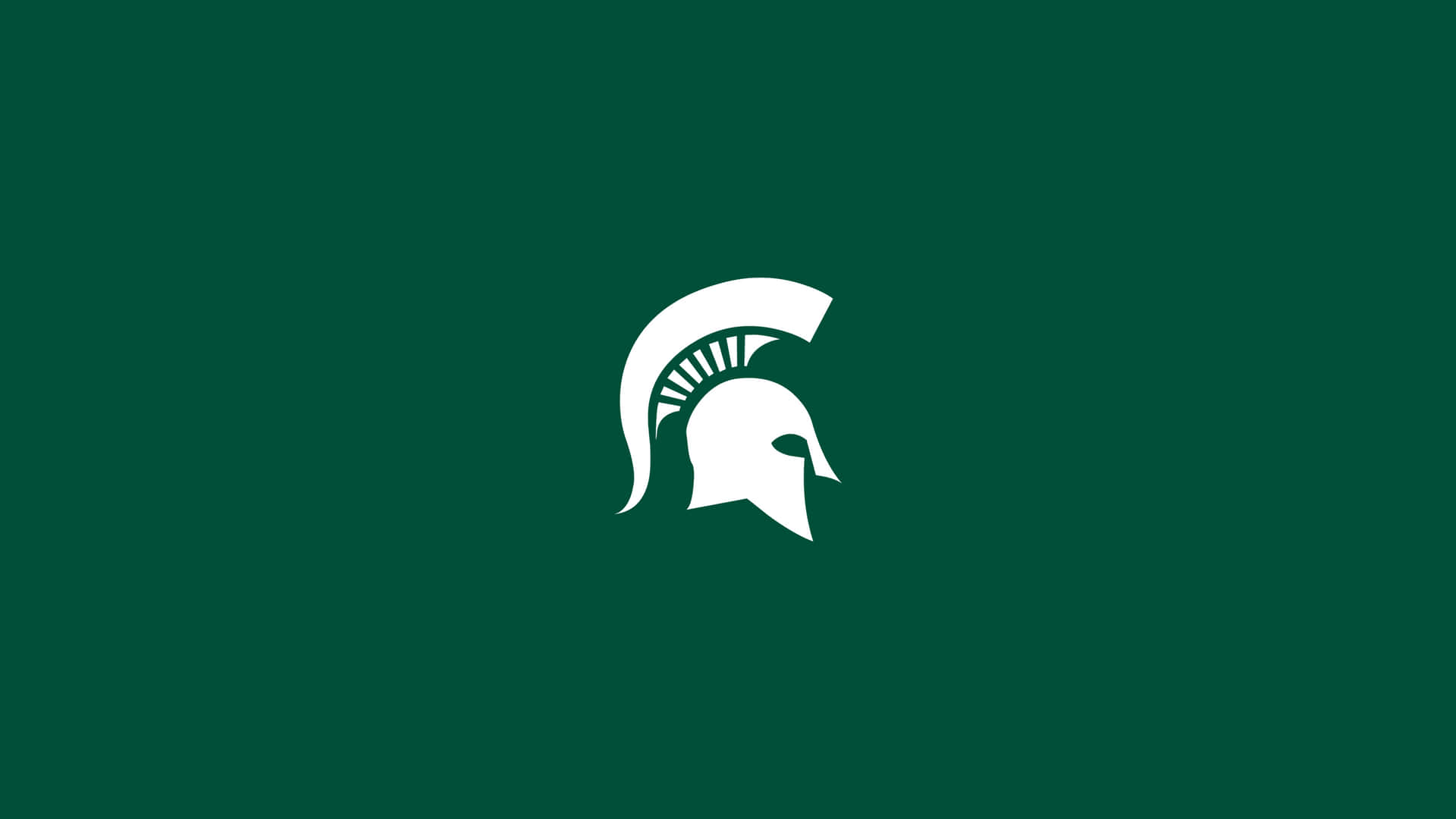 Logode Los Spartans De La Universidad De Michigan En Un Fondo Verde. Fondo de pantalla