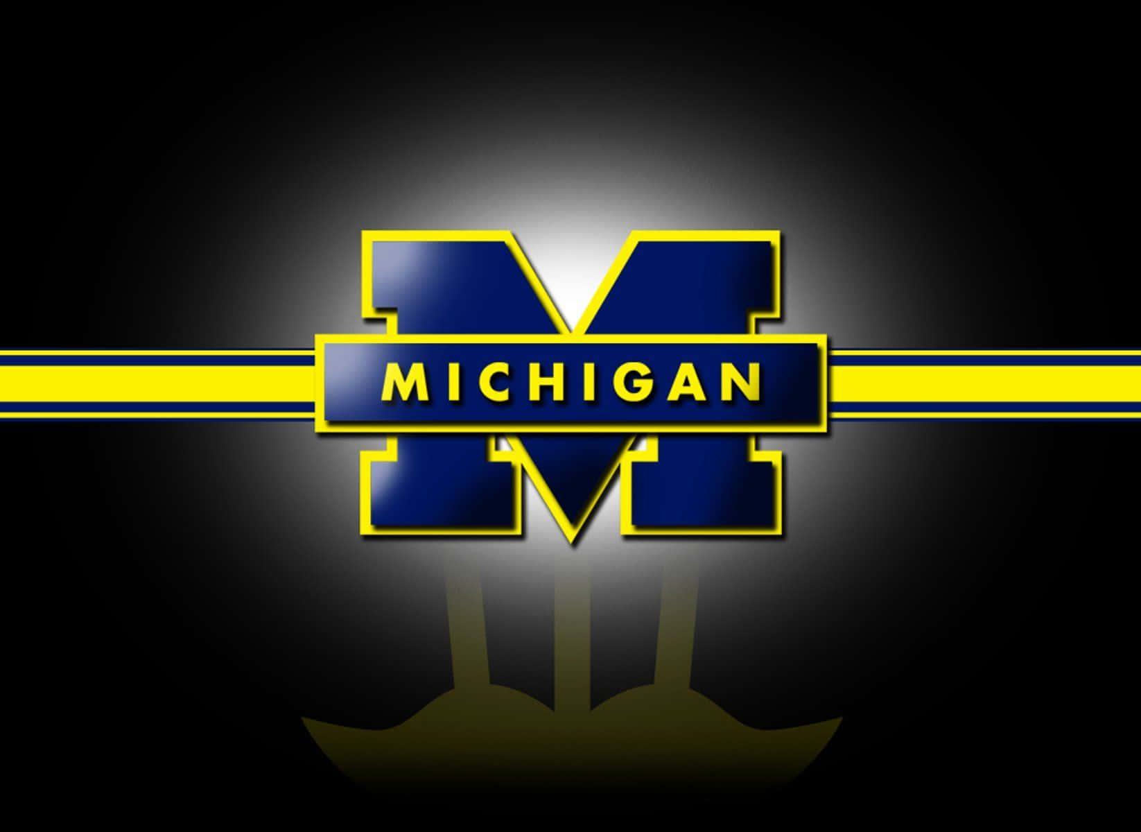 Michigan Wolverines Football Team in Action Wallpaper