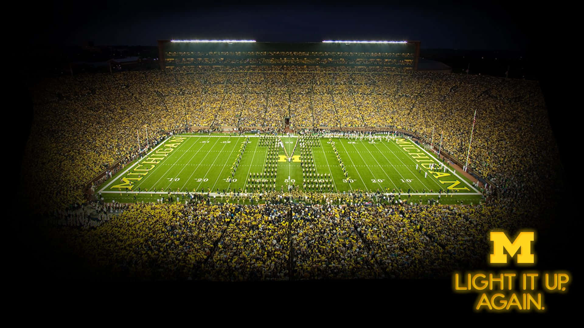 Michigan Wolverines Football Team Charging on the Field Wallpaper