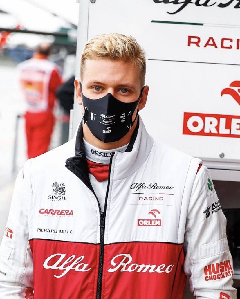 Mick Schumacher In Jacket And Mask Wallpaper