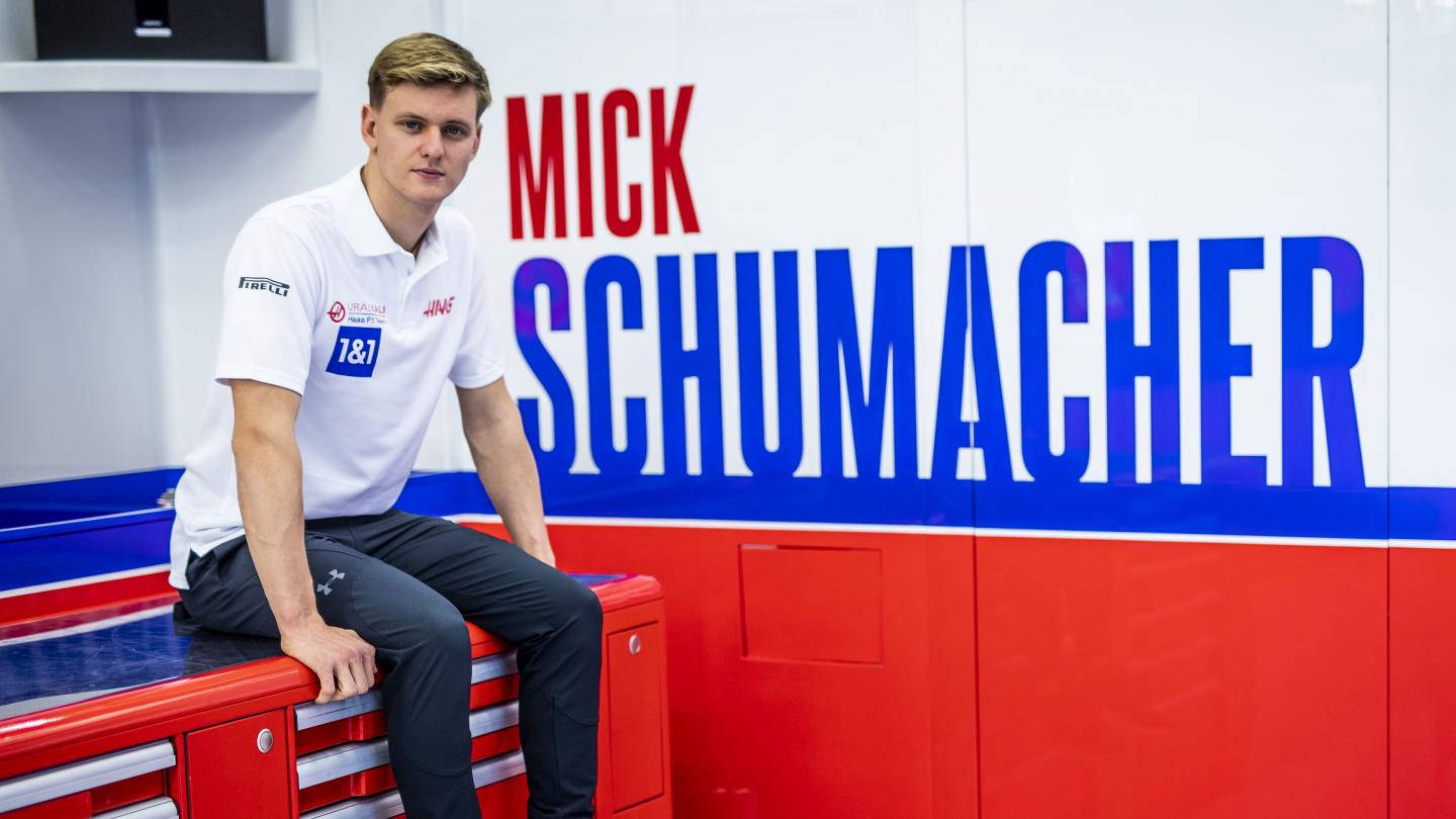 Mick Schumacher Sitting On Counter Wallpaper
