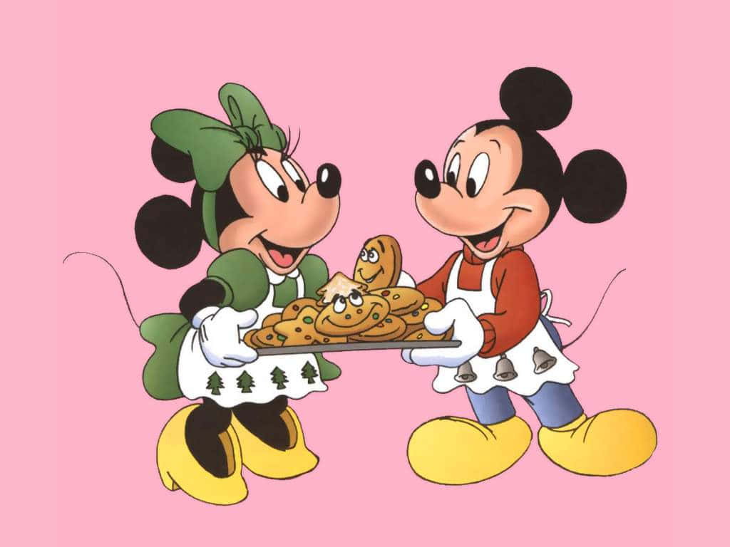 Mickey Mouse And Minnie Mouse Holding A Cookie