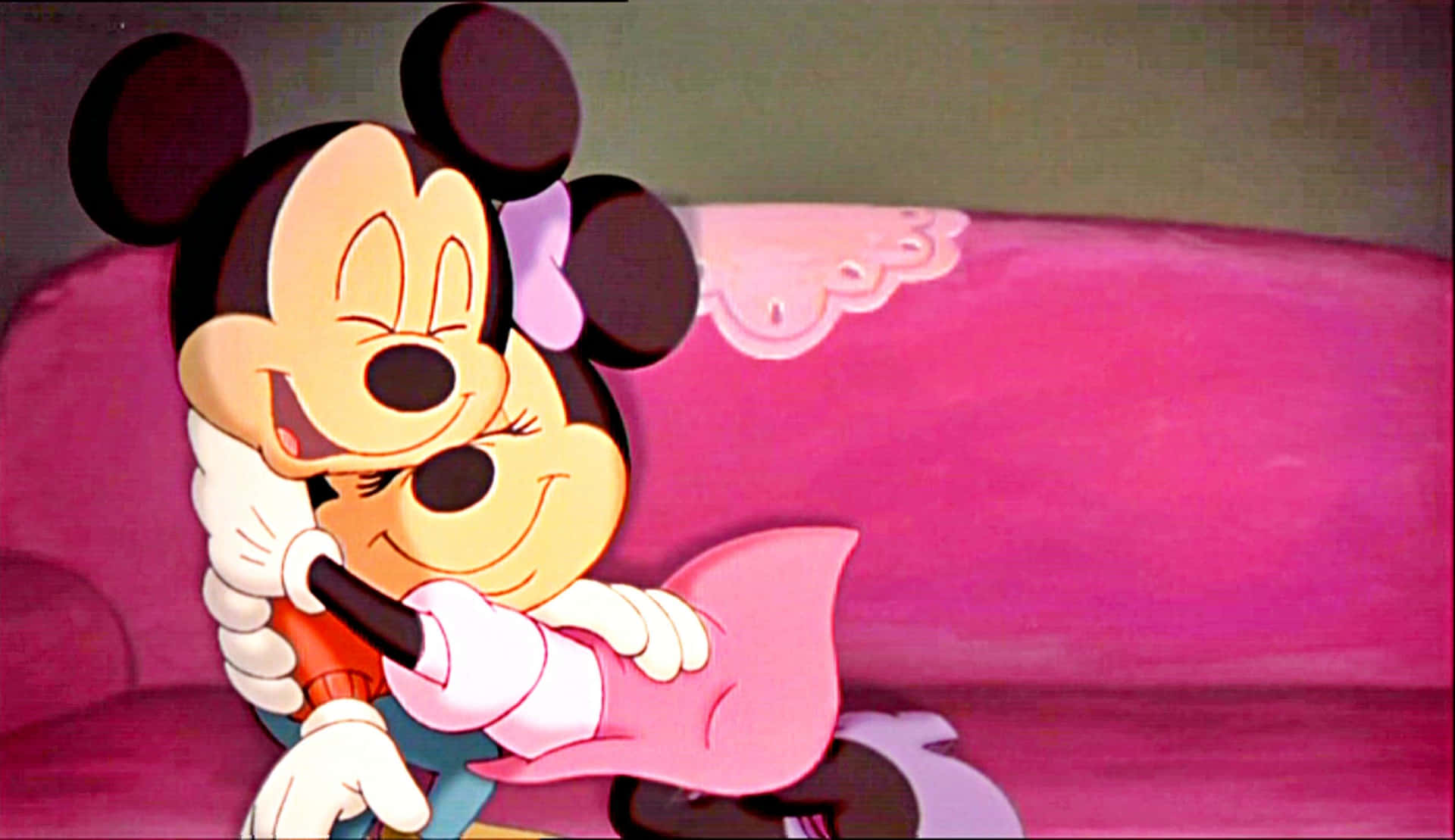 A Cartoon Of Mickey And Minnie Hugging On A Pink Couch