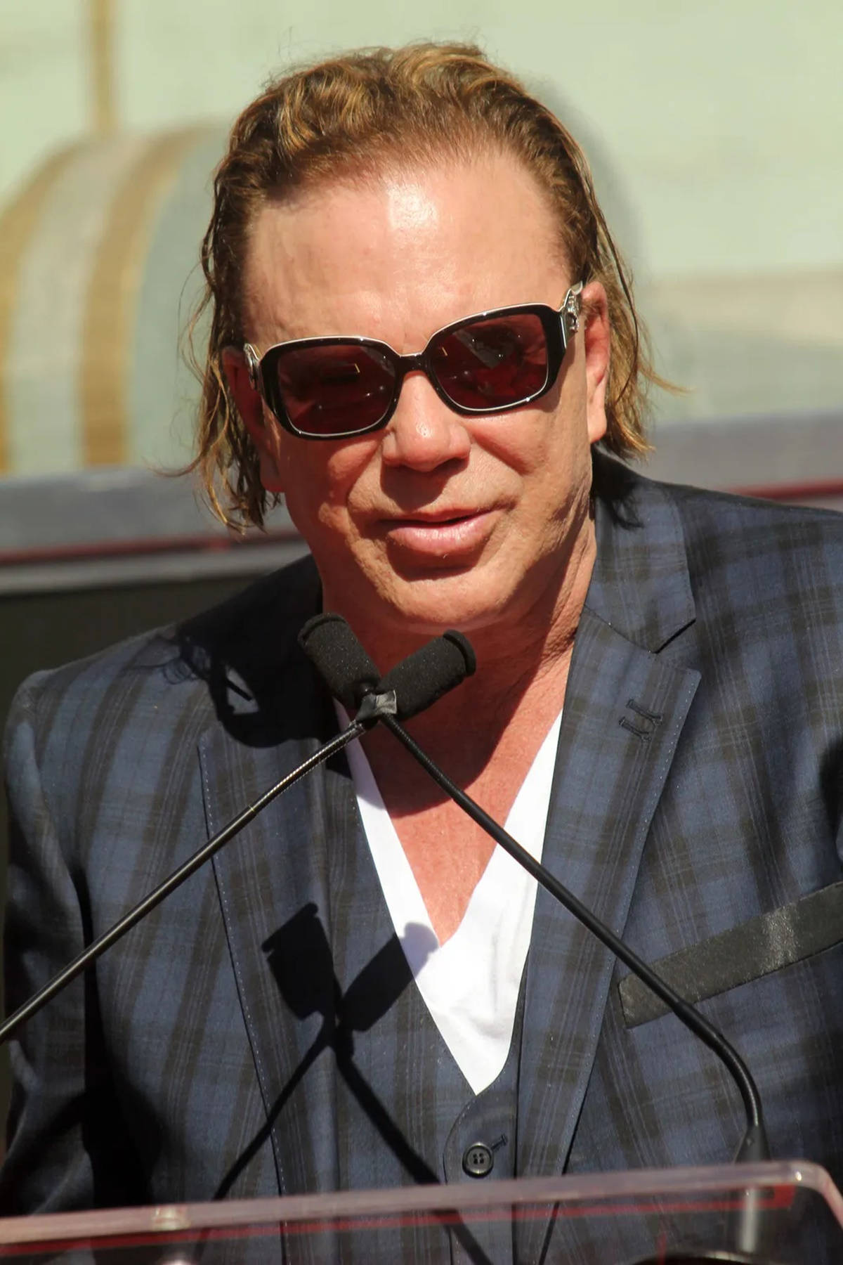 Mickey Rourke Speaking At Hand and Footprint Ceremony Wallpaper