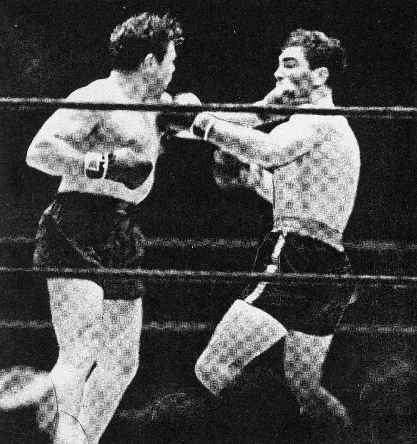 Mickey Walker Punching Opponent Inside Ring Wallpaper