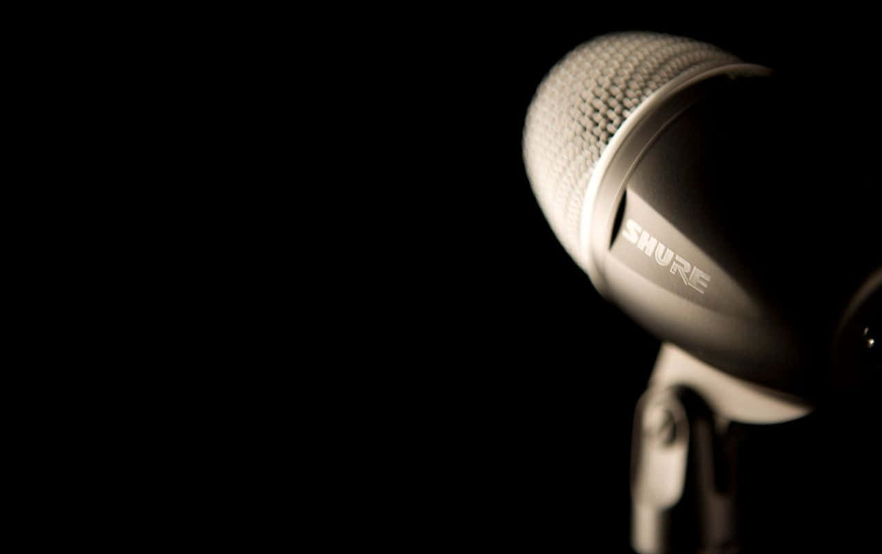 A Microphone Is On A Black Background