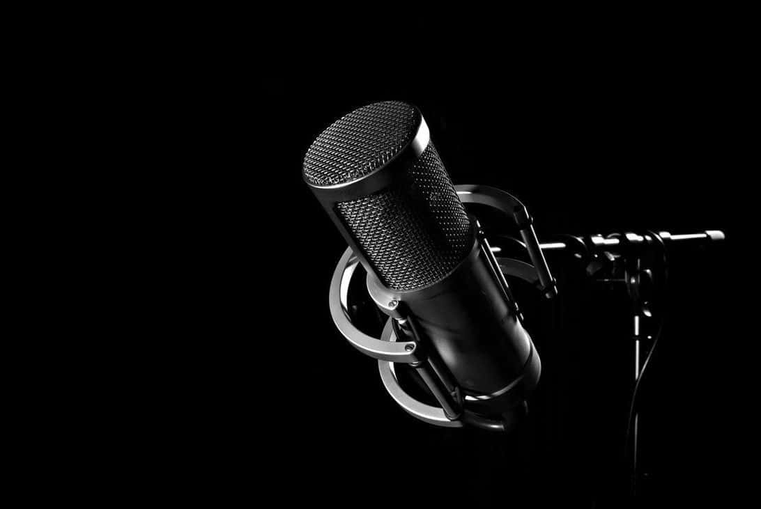A Microphone Is Shown On A Black Background