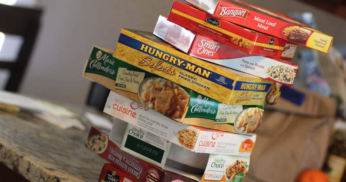 A Stack Of Boxes Of Food On A Counter