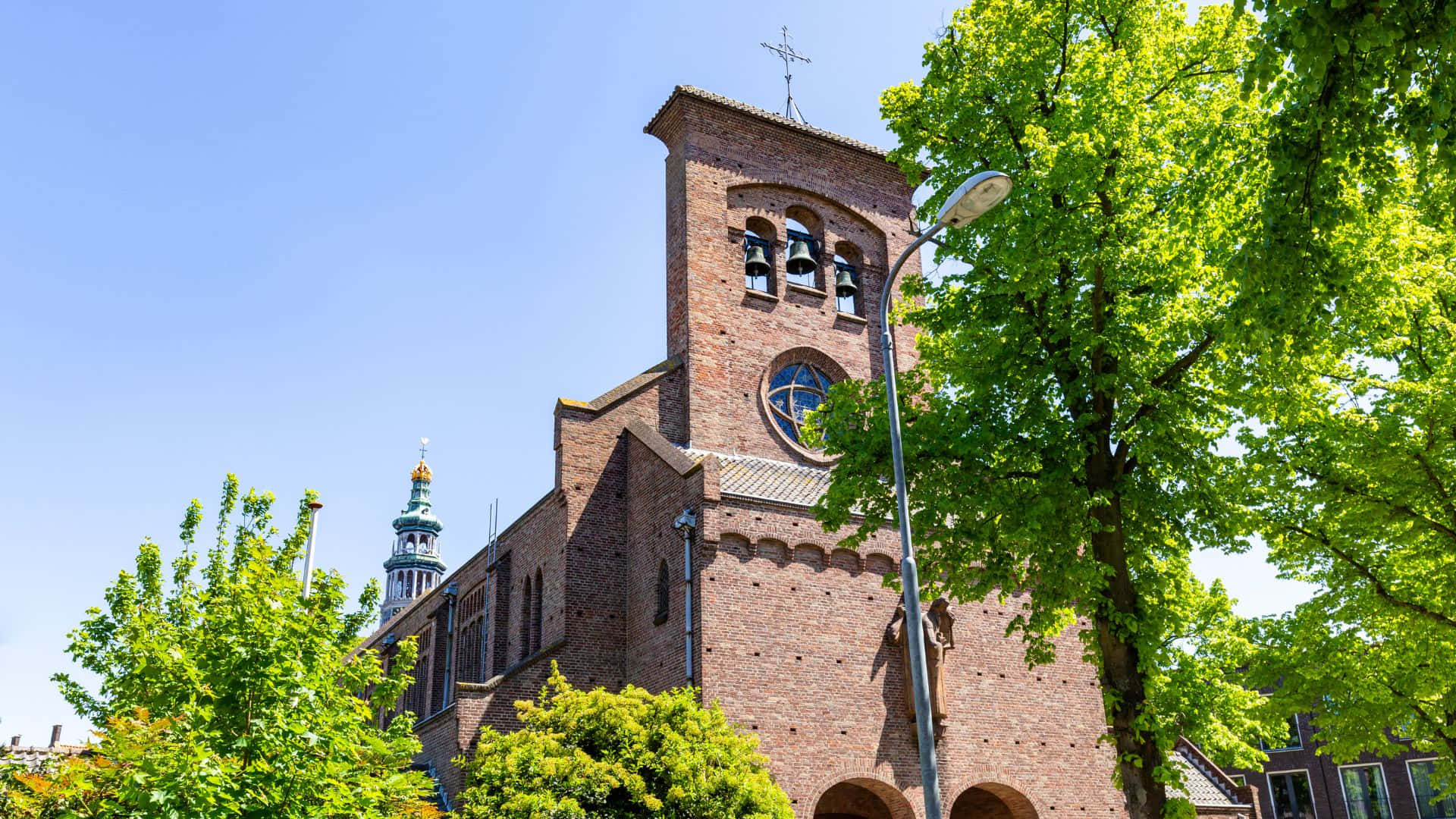 Download Middelburg Church Tower Springtime Wallpaper | Wallpapers.com