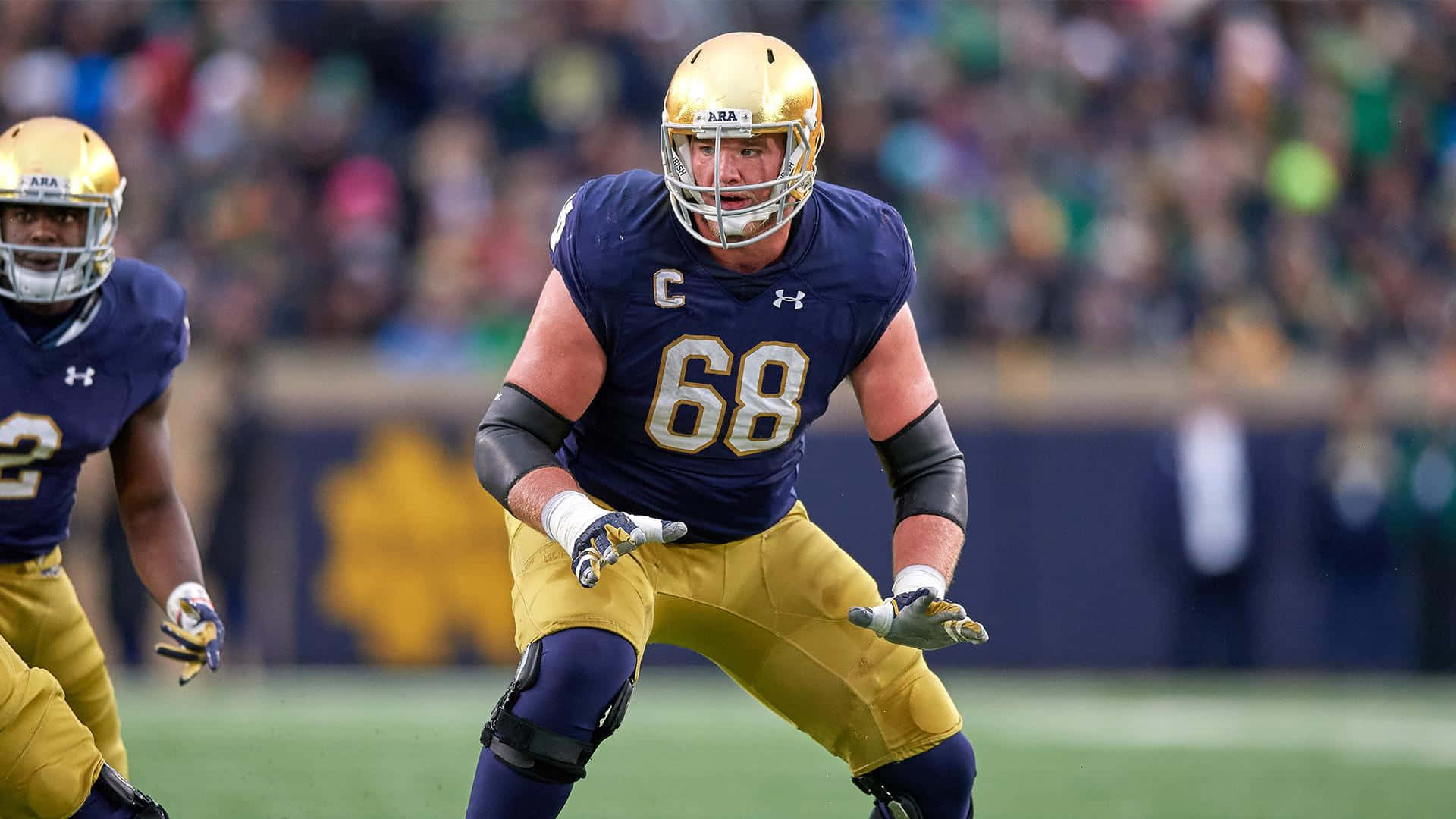 Mike McGlinchey in action during a football game Wallpaper