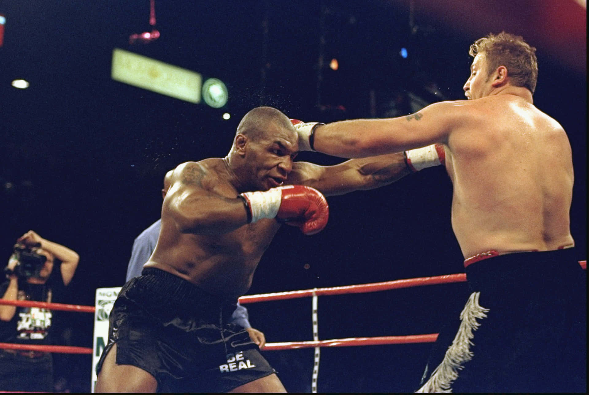 Mike Tyson throwing a powerful punch in the ring