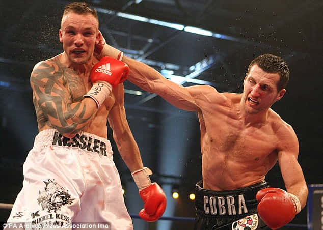 Mikkel Kessler Throwing A Right Hook In Competition Wallpaper