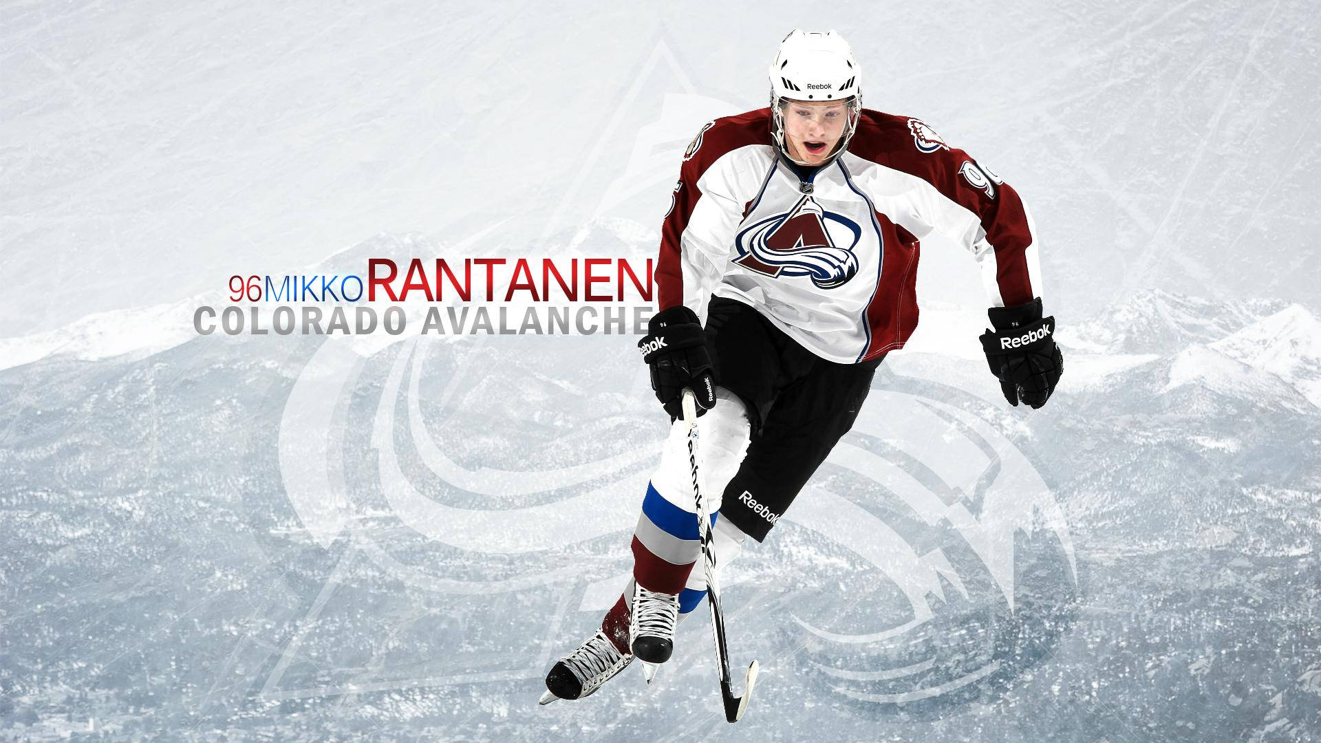 Mikko Rantanen Crossed Legs While Skating And Holding Hockey Stick Wallpaper