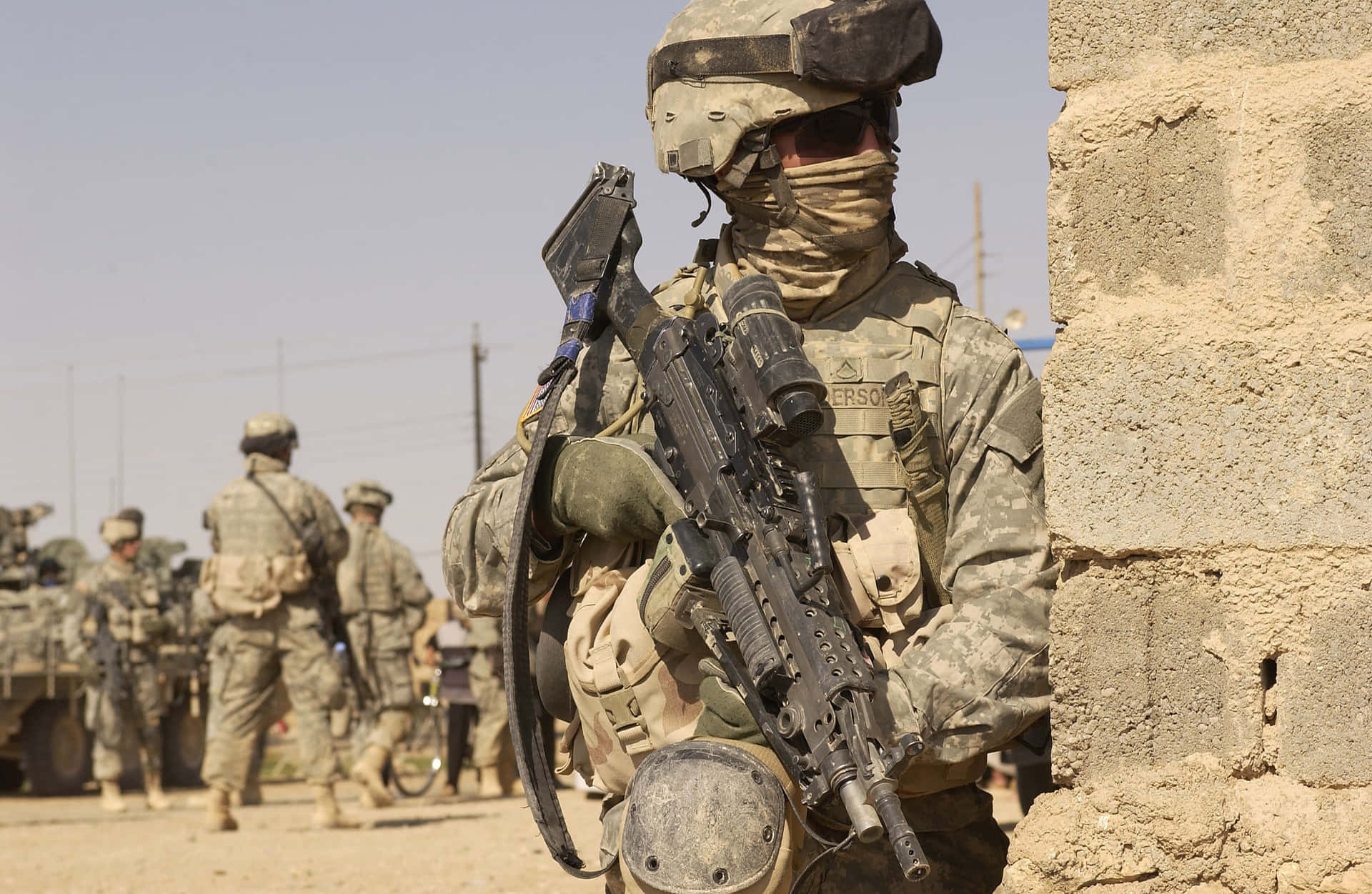 Military Uniform Holding Gun Wallpaper