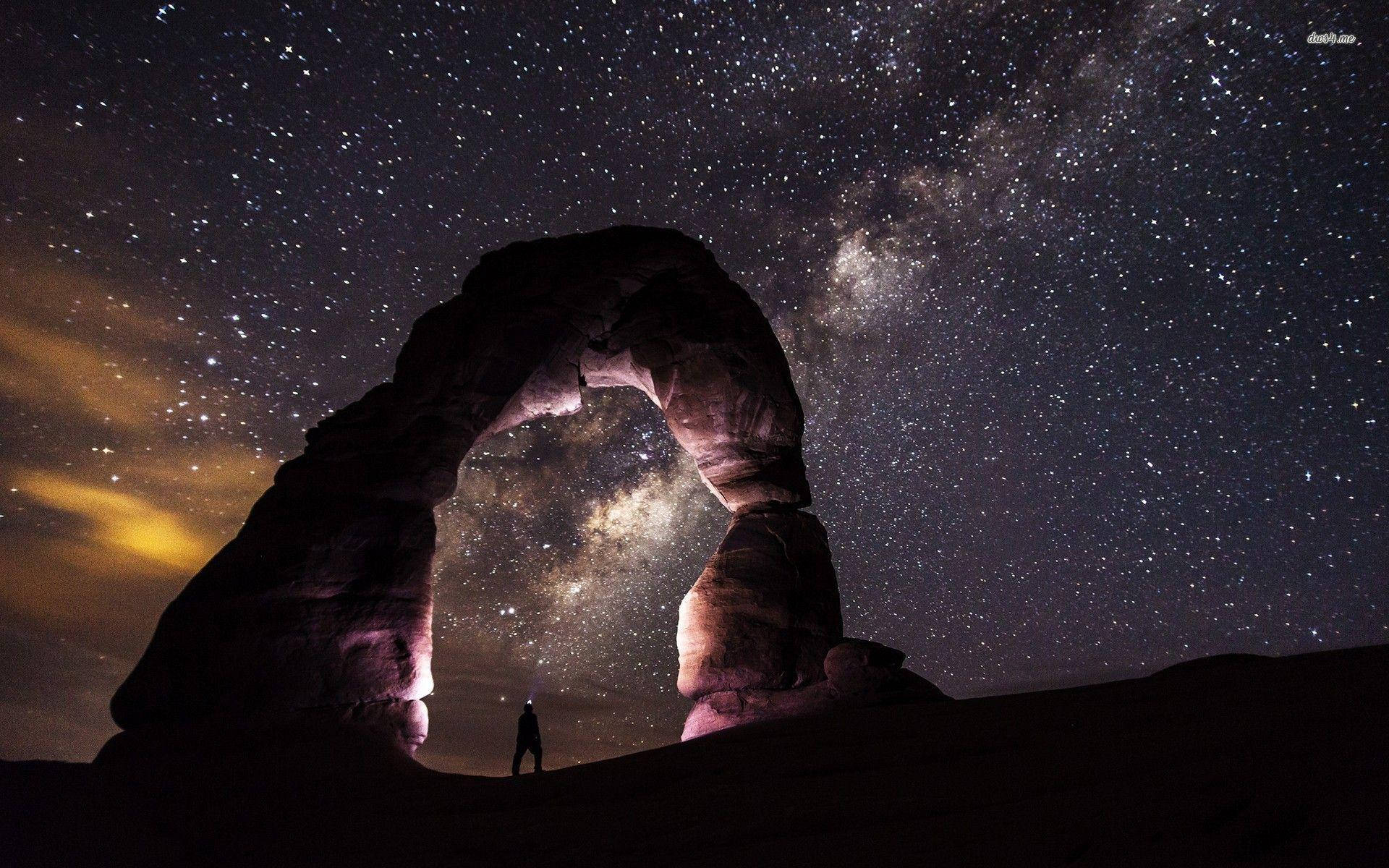 Milky Way Over A Rock Formation Wallpaper
