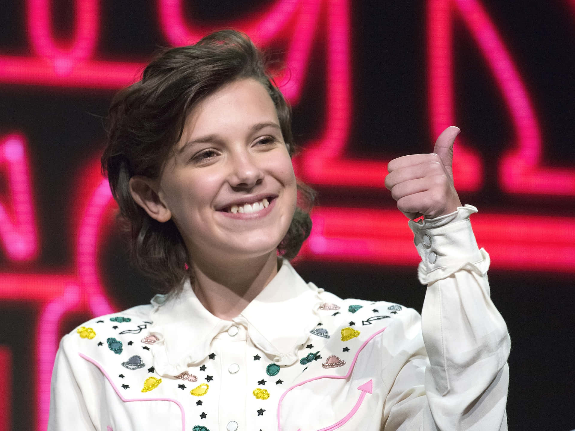Actress and producer Millie Bobby Brown with a smile on her face