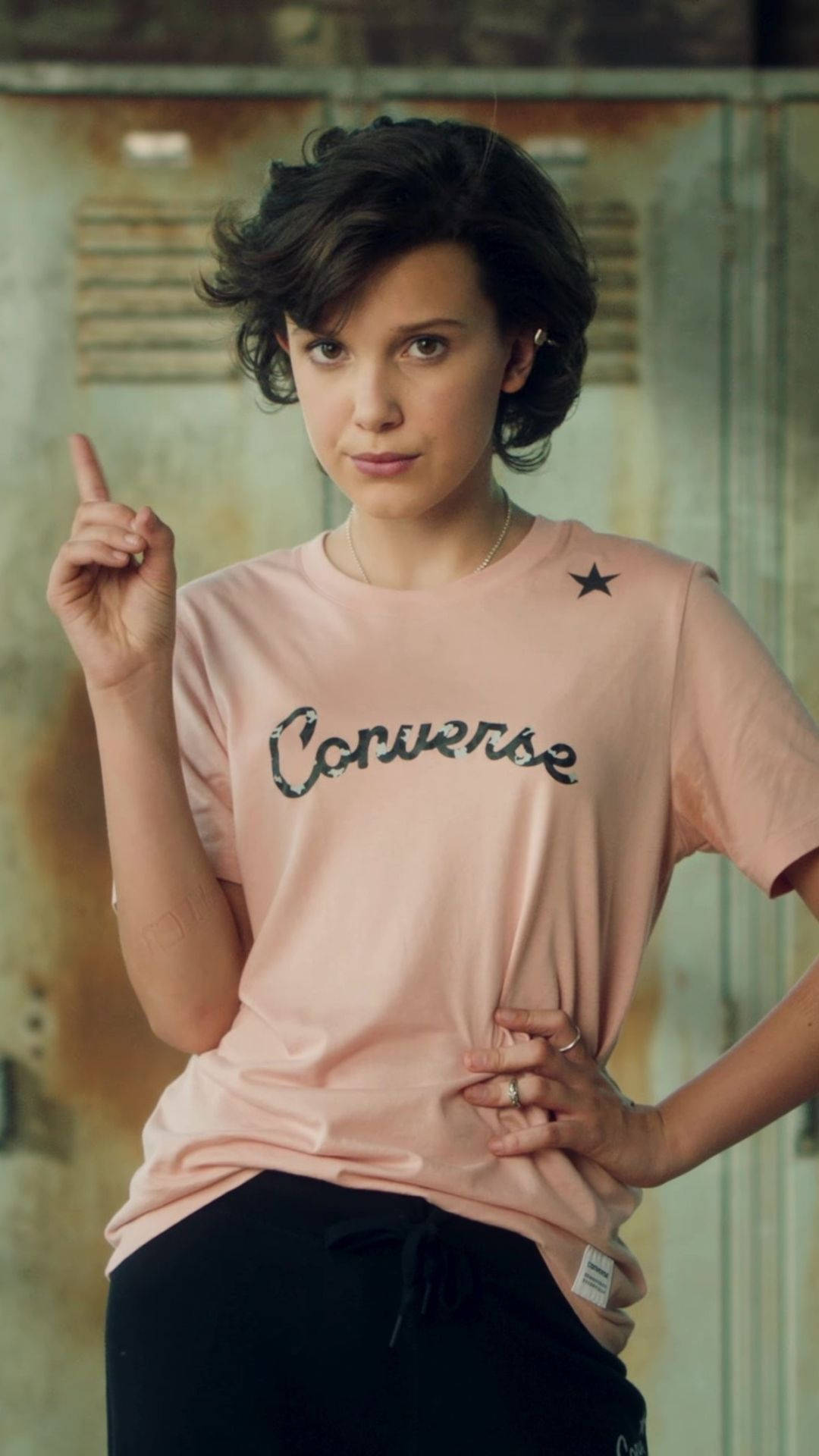 Millie Bobby Brown in a casual Converse shirt Wallpaper