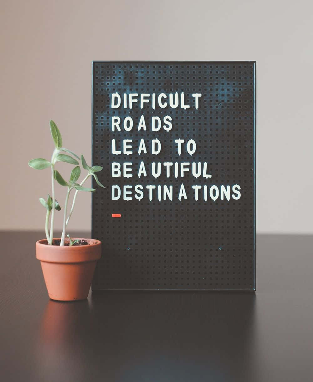 A Poster With The Words Difficult Roads Lead To A Wonderful Destination Wallpaper