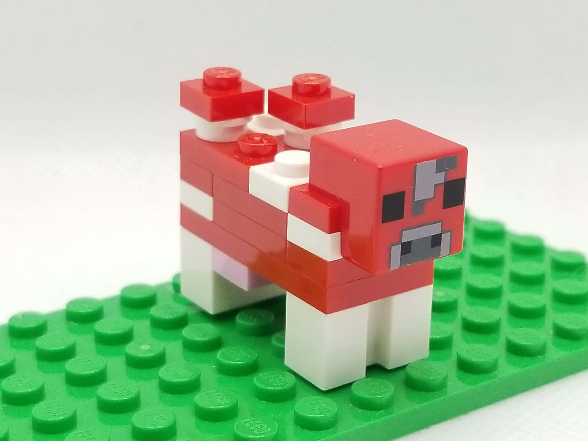 Majestic Minecraft Cow in Vibrant Block World Wallpaper