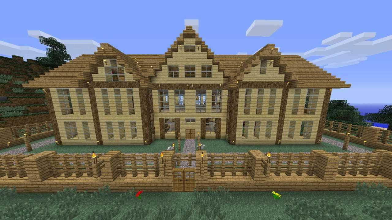 Et hus i Minecraft med en træfence